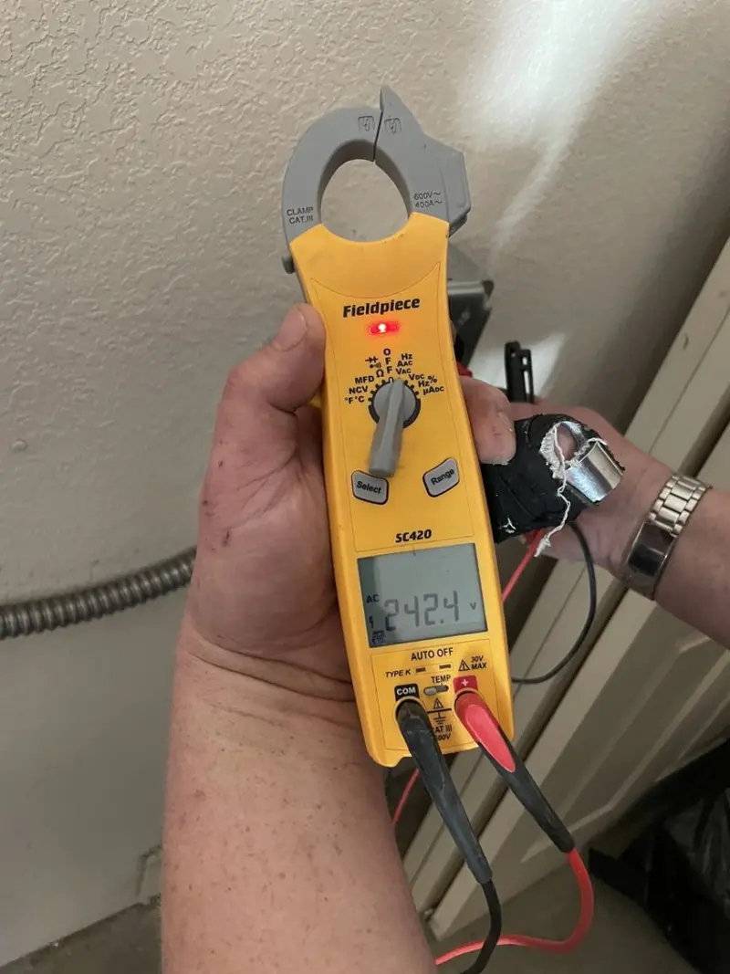 Voltage testing with clamp meter during Generator Installation in Clifton